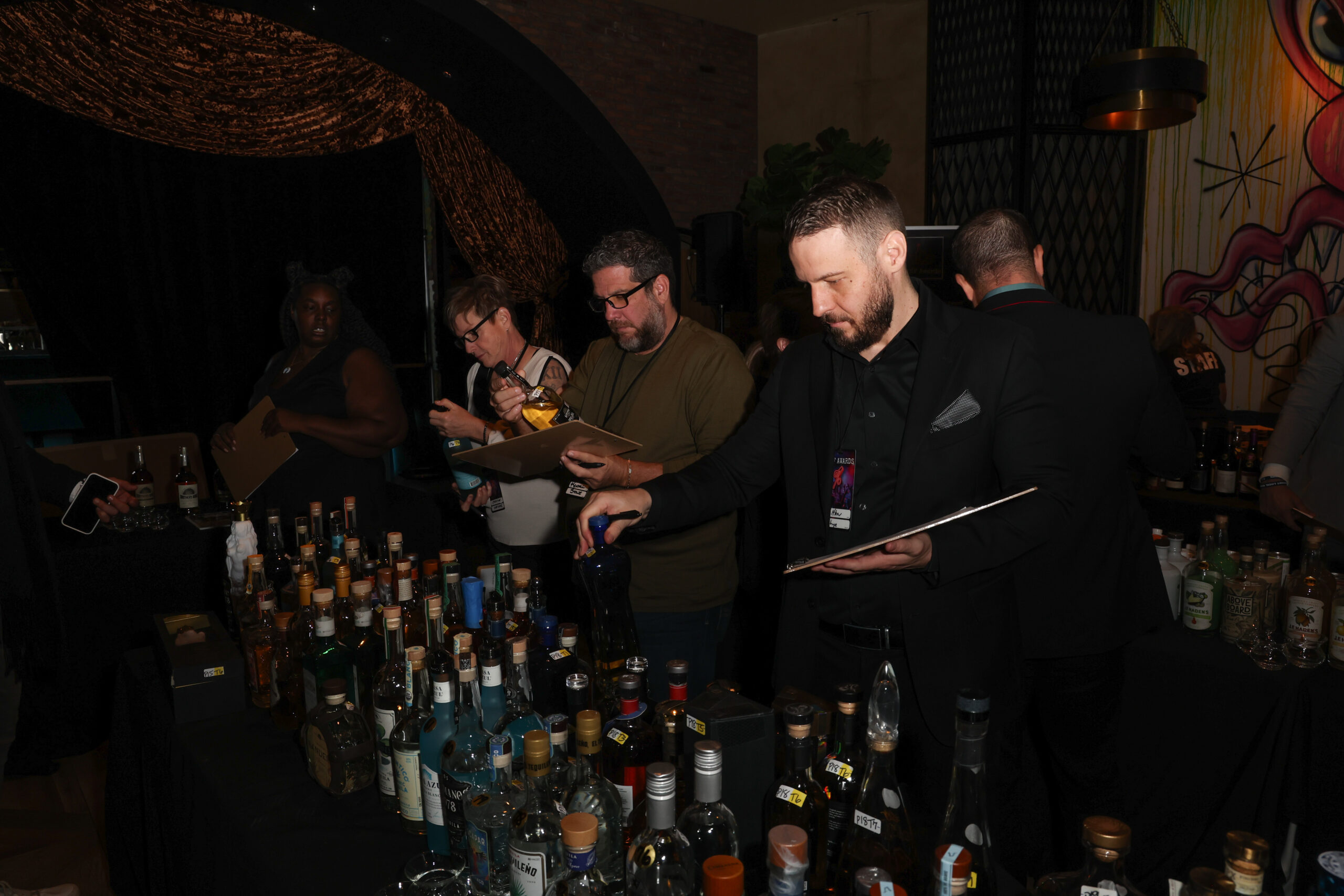 Judges during the Unmasked portion of PR%F Awards judging the look and feel of the bottles.
